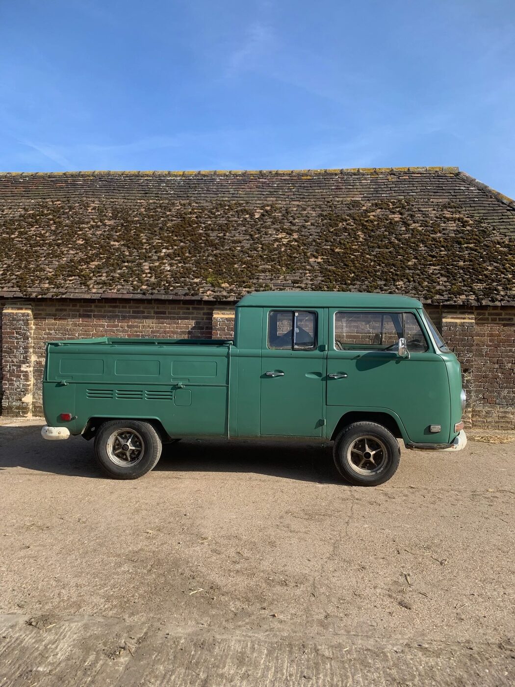 Green VW T2 Bay crew-cab pickup