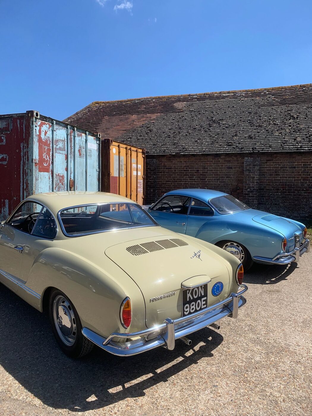 A pair of VW Karmann Ghias — cream and blue