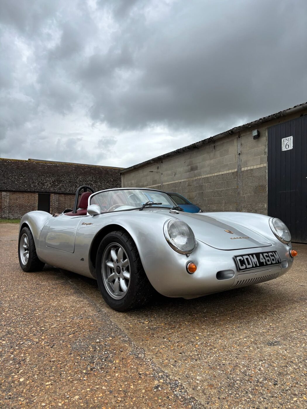 Silver Porsche 550 Spyder at the workshop